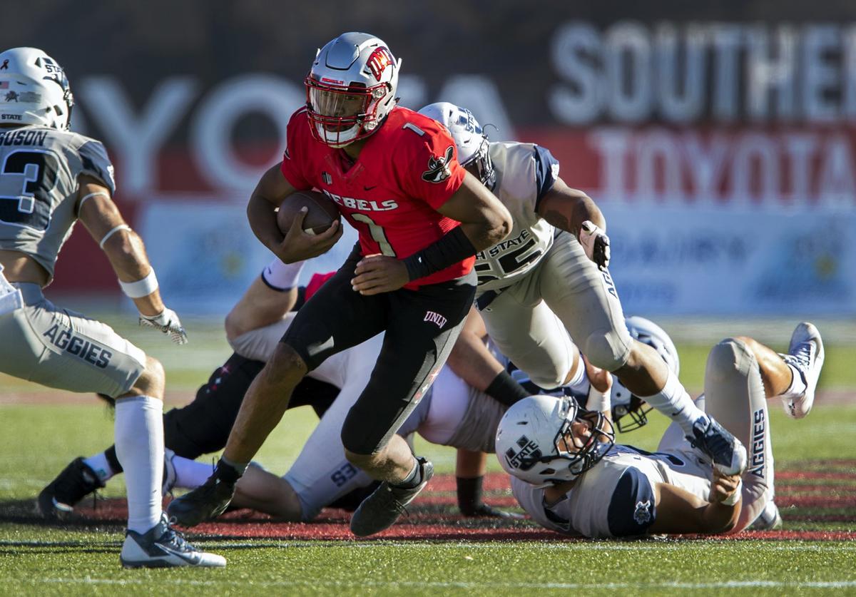 UNLV quarterback Armani Rogers (1) looks for room to run in a game last season against Utah State. Rogers, who has missed the past four games with a toe injury, has been cleared to play against Fresno State Saturday, Nov. 3, 2018 at Sam Boyd Stadium in Las Vegas.