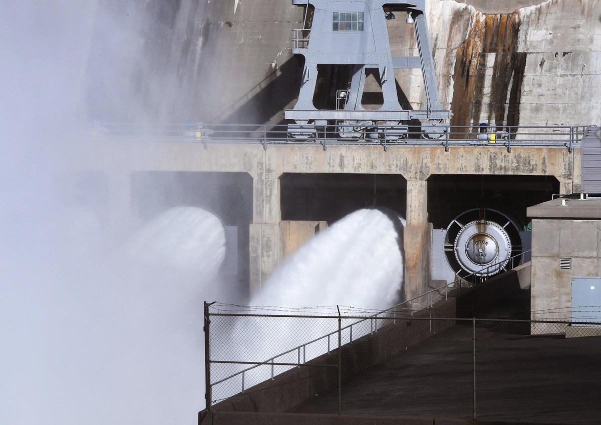 Water flows from Friant Dam as the Bureau of Reclamation increased water releases Friday, Jan. 6, 2023 near Friant.