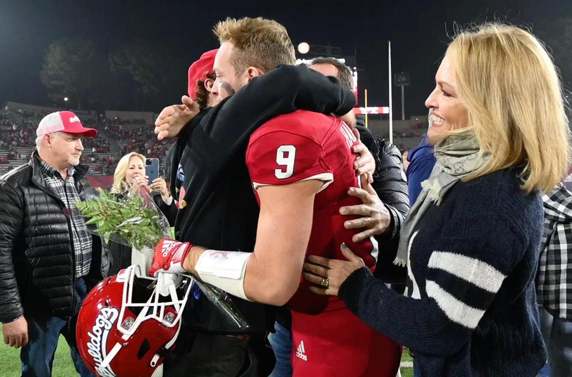 Family greets Fresno State senior quarterback Jake Haener, center, before the game against Wyoming Friday, Nov. 25, 2022 in Fresno.