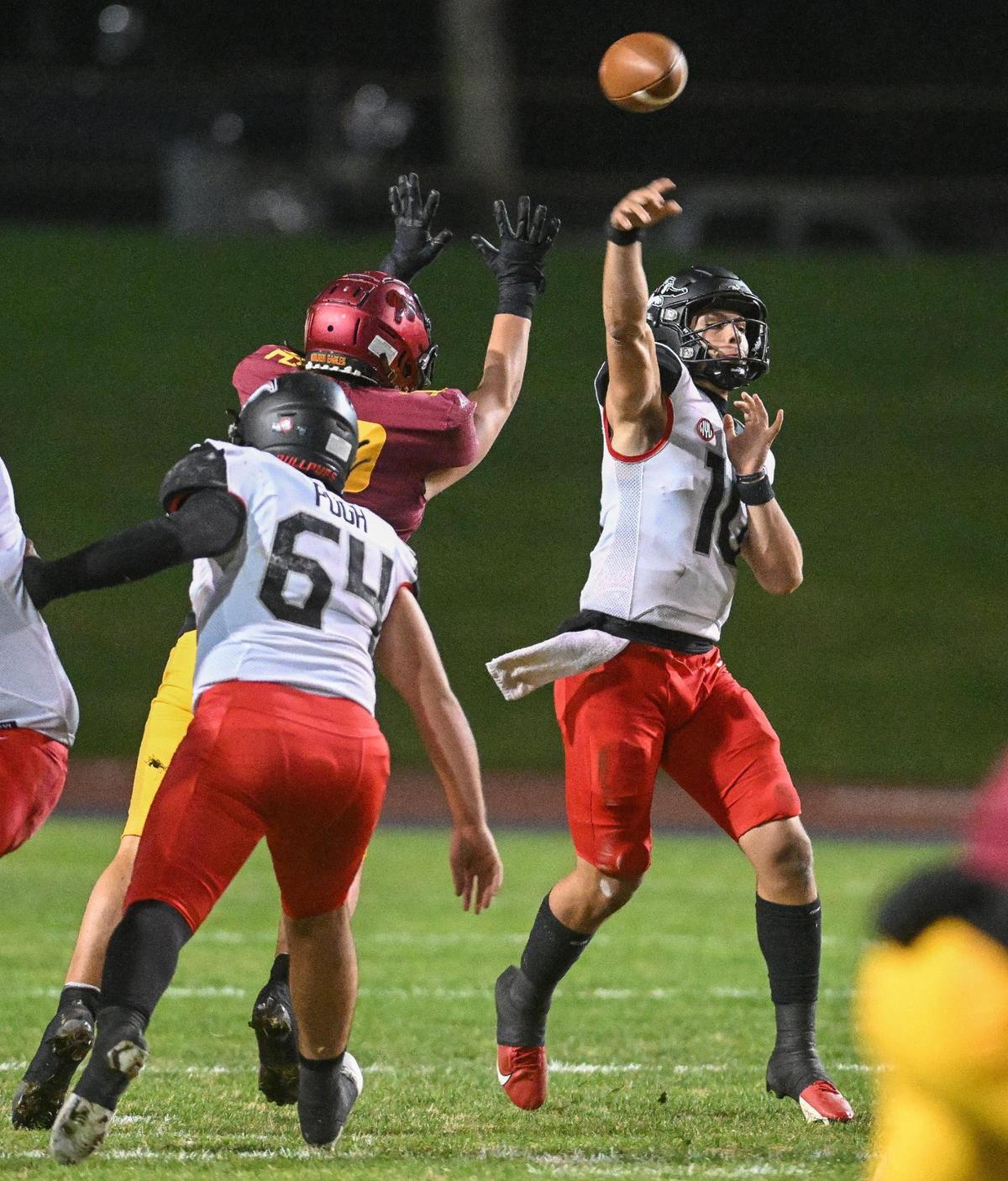 Hanford quarterback Daniel Gomez throws downfield against Clovis West in their first-round Central Section playoff game at Veterans Memorial Stadium in Clovis on Friday, Nov. 3, 2023.