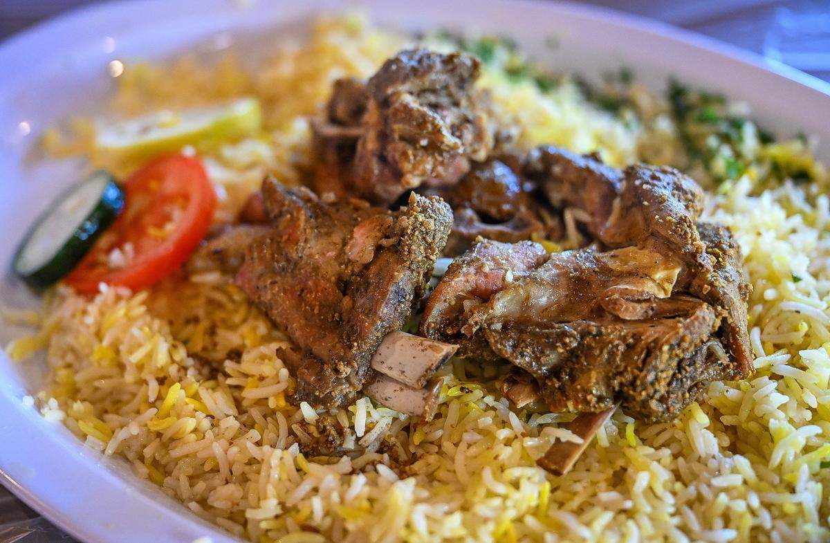 Madfoun lamb is oven-roasted lamb and Mandi rice available at Al-Hadara Mediterranean Restaurant & Cafe which recently opened northeast of Blackstone and Shaw.