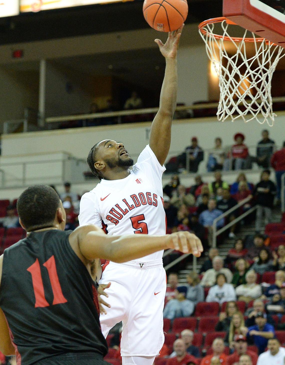 Fresno State guard Jordan Campbell drives past San Diego State’s Matt Mitchell during the Bulldogs 64-55 loss to the Aztecs at the Save Mart Center in Fresno on Tuesday, Jan. 14, 2020. The Bulldogs are now 5-12, 1-5 in the Mountain West.
