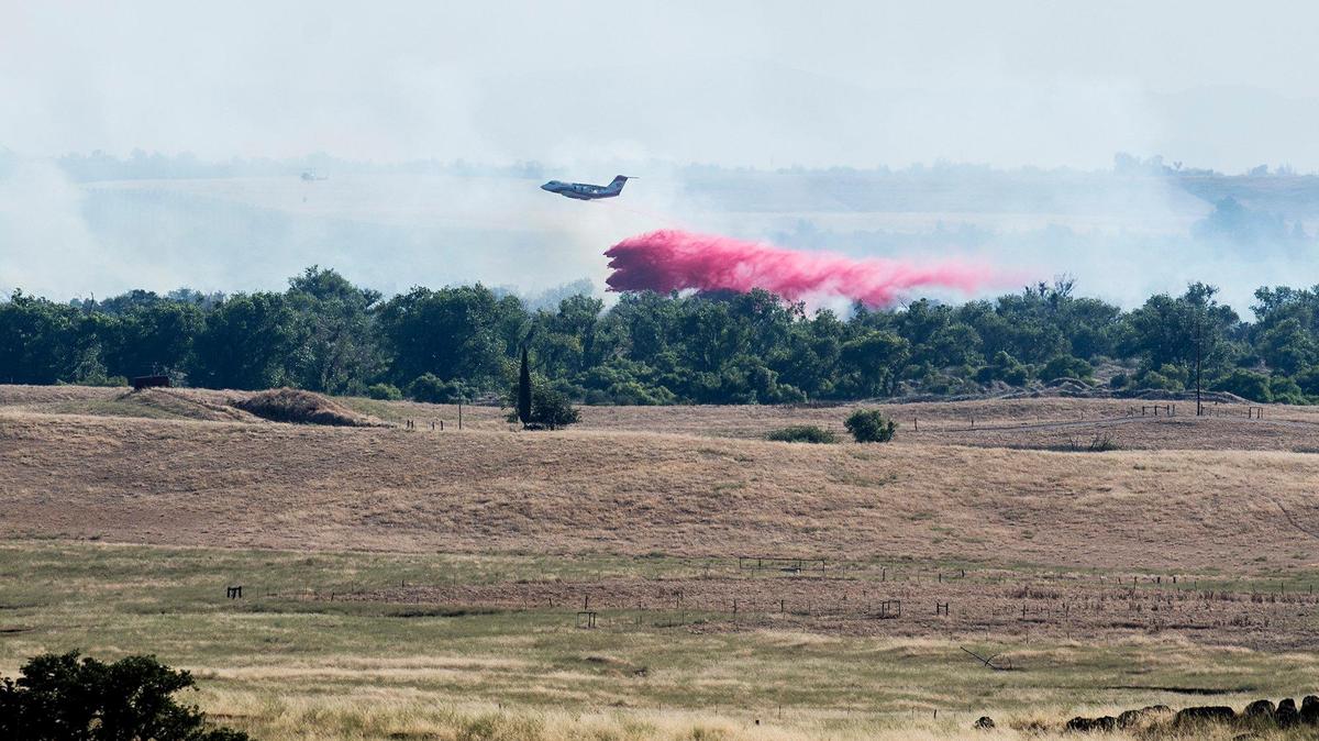 Firefighters battle a wildfire off of Merced Falls and La Grange roads, east of Snelling on Saturday, June 29, 2019.