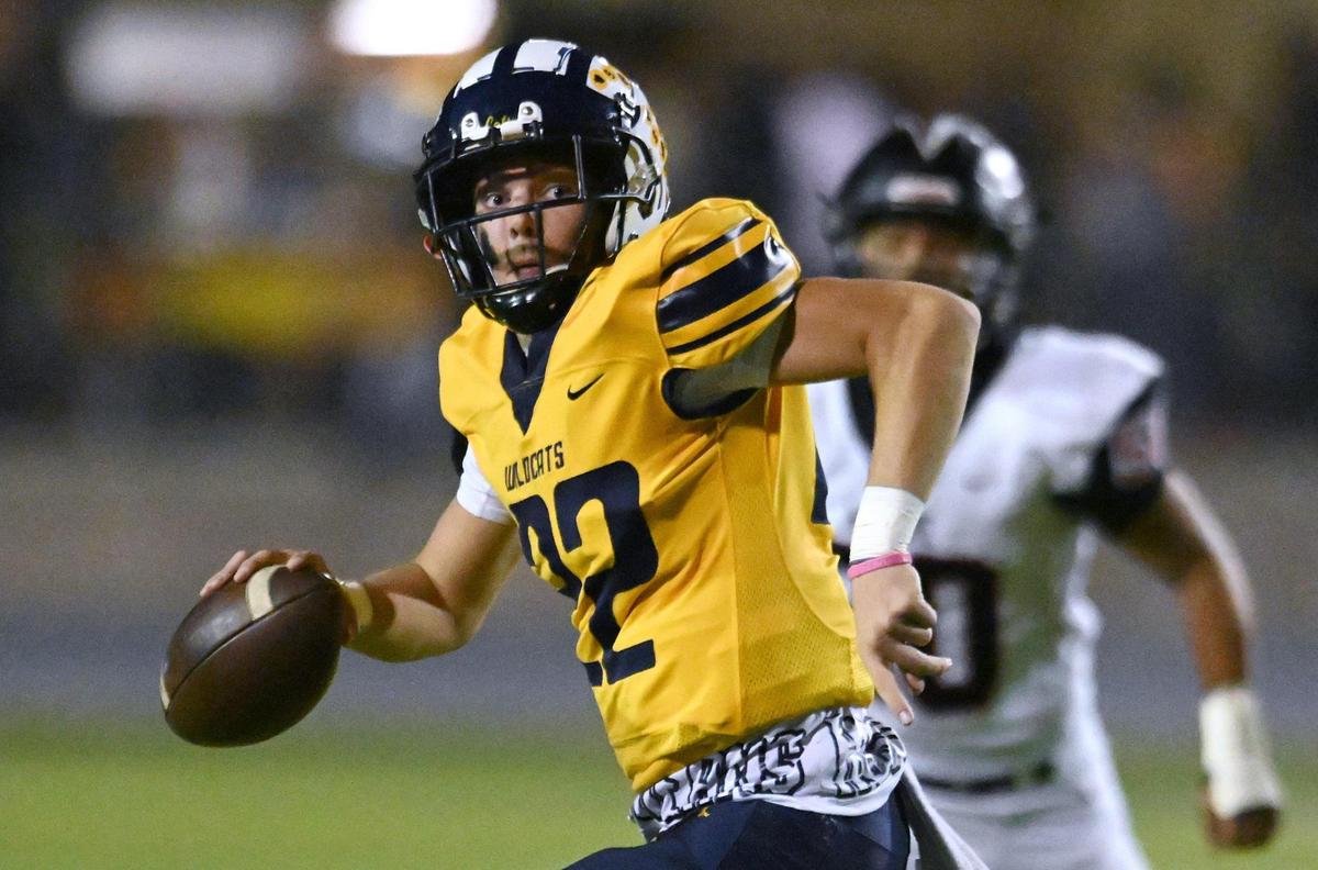 Sunnyside quarterback Tanner Wilson looks to pass downfield against McLane Friday, Oct. 20, 2023 in Fresno.