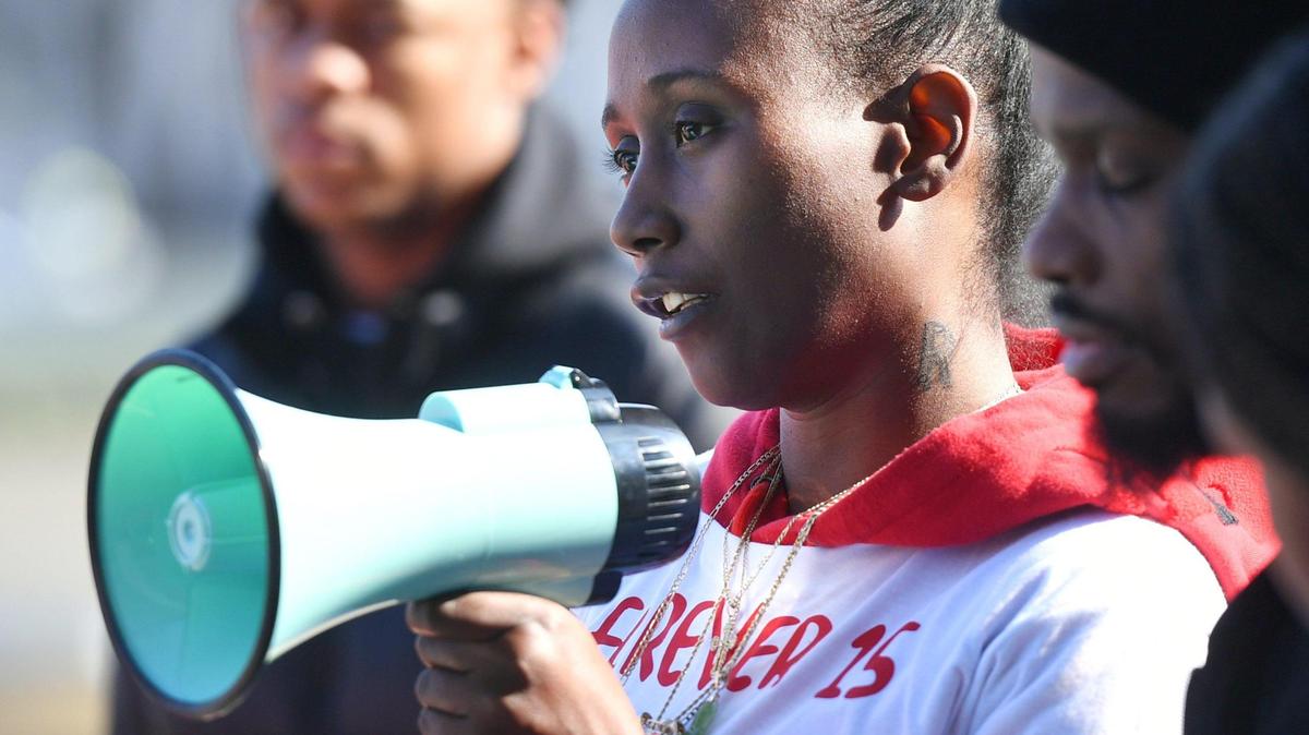 Regina Bell, mother to Rashad Al-Hakim Jr., the 15-year old Hoover High School student killed in a hit and run Oct. 4, 2022, speaks out to those gathered as a rally is held seeking justice outside the Fresno County Courthouse Monday morning, Jan. 23, 2023 in Fresno.