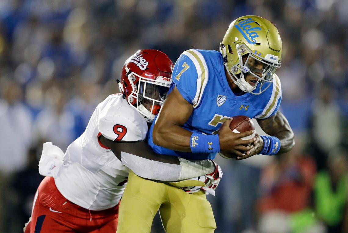 Fresno State linebacker Jeff Allsion sacks UCLA quarterback Dorian Thompson-Robinson, right, during the Bulldogs’ 38-14 victory over the Bruins Saturday, Sept. 15, 2018, in Pasadena. For the Bulldogs, the victory snapped a 10-game losing streak against teams from Power Five conferences.