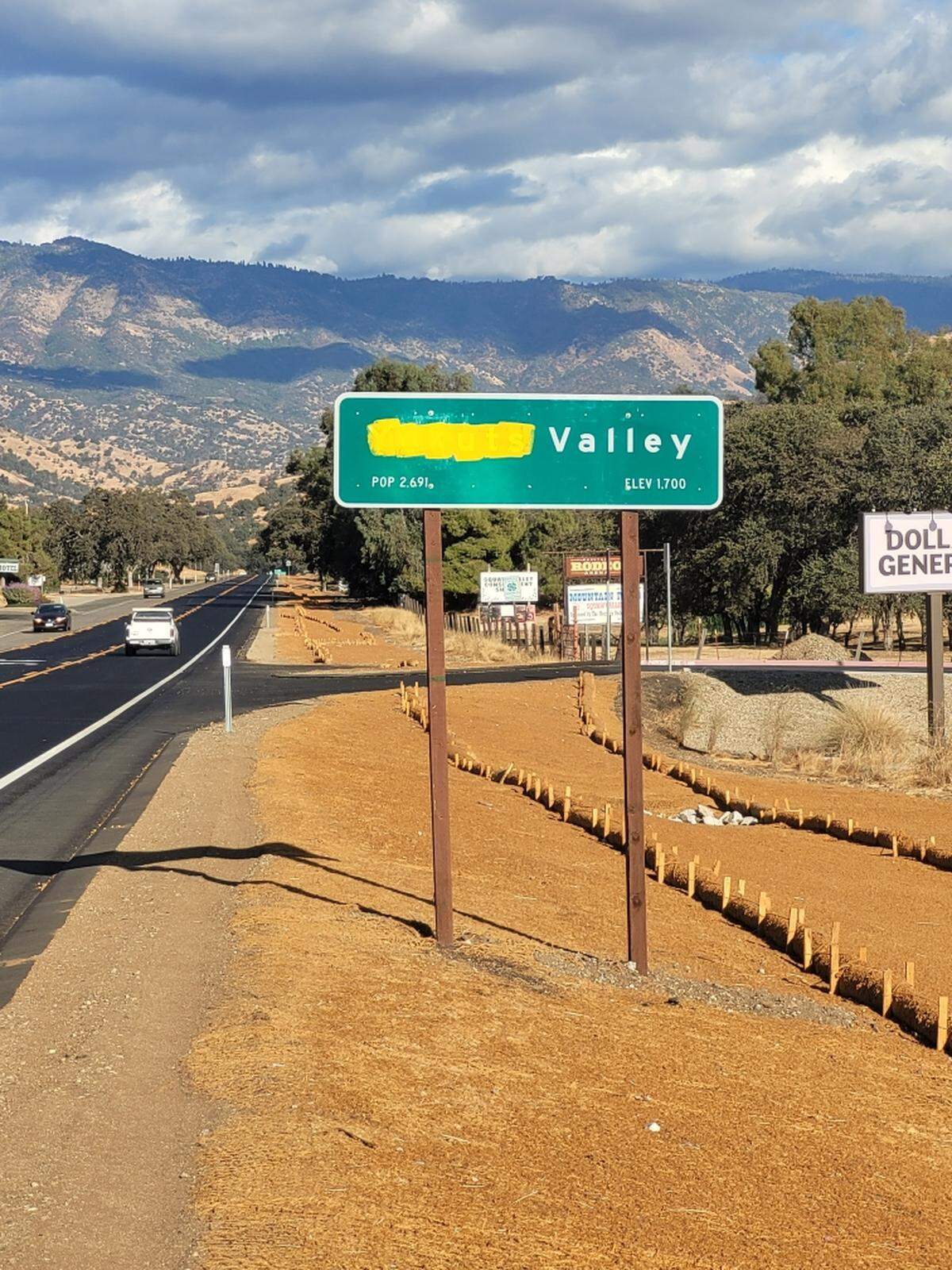 Photo of “Yokuts Valley” sign on Highway 180 photographed on Monday Oct. 28, 2024. The work “Yokuts” appears to be covered in yellow paint.