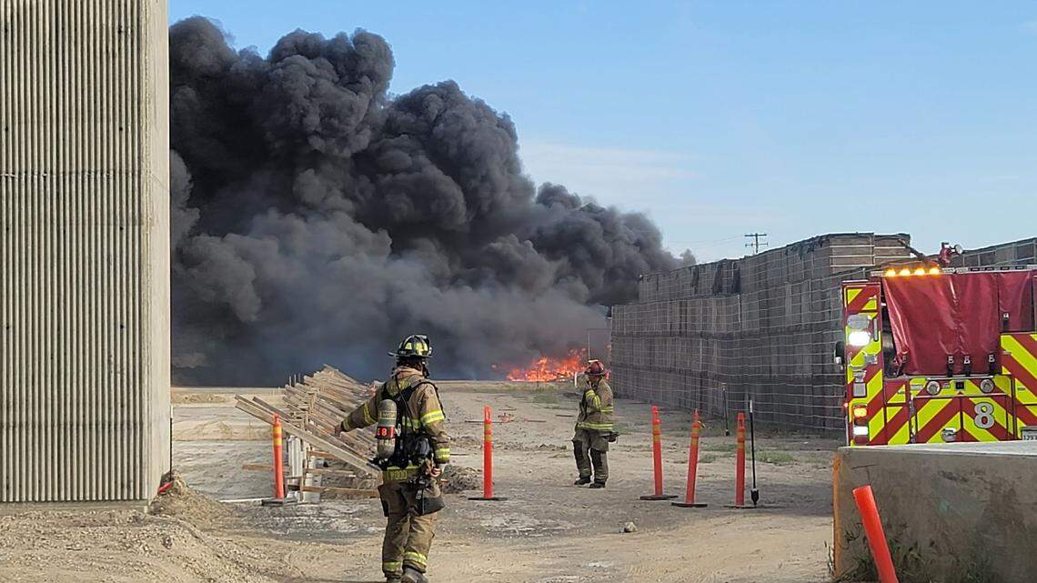 Fresno fire crews work to extinguish fire at a packaging company in the area of Golden State Boulevard and Orange Avenue in southeast Fresno on Sunday, March 27, 2022.