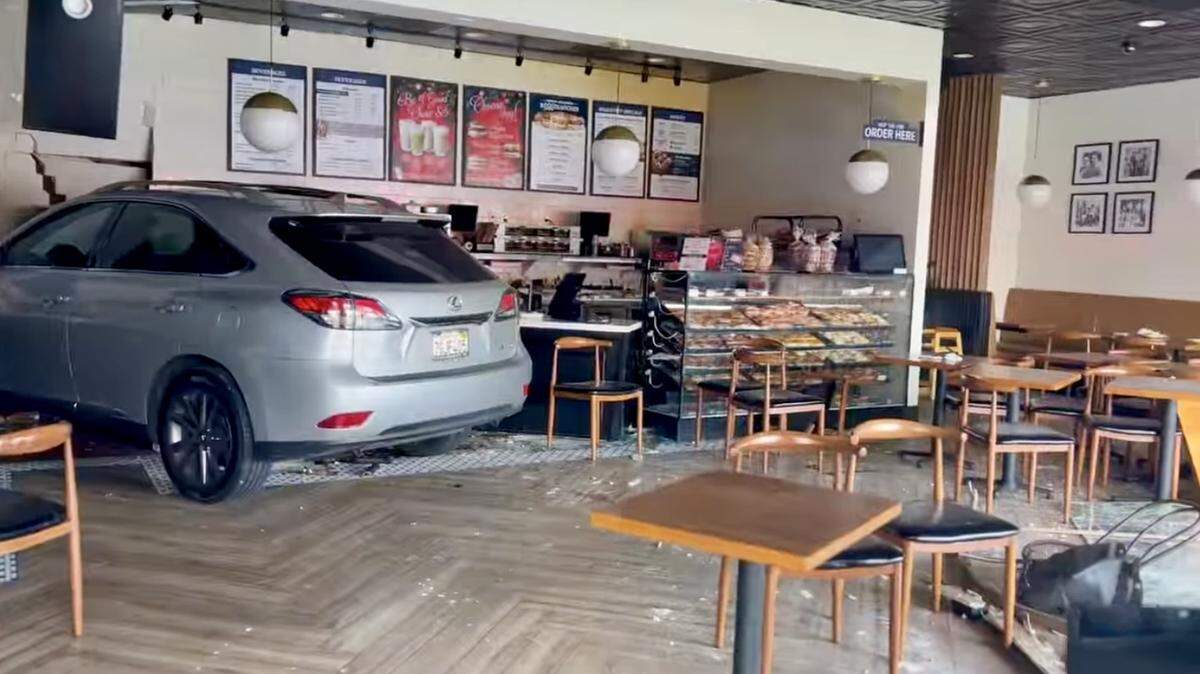 A car crashes into Uncle Harry’s bagel shop near Fresno State on Friday, Jan. 3, 2024.