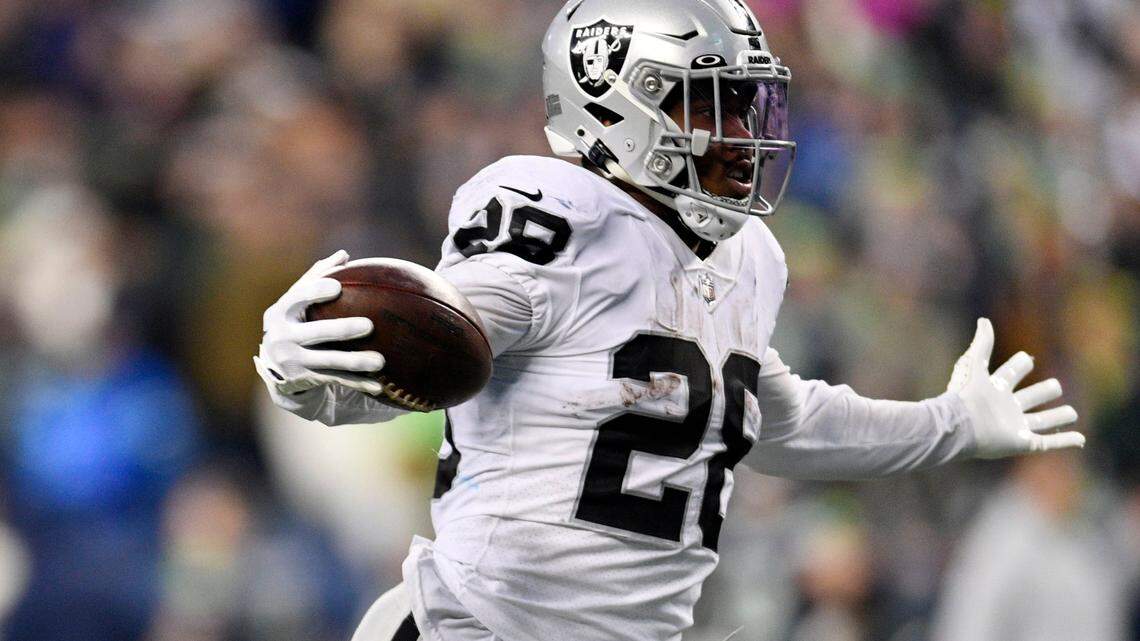 Las Vegas Raiders running back Josh Jacobs celebrates as he scores the game-winning touchdown during overtime of an NFL game against the Seattle Seahawks Sunday, Nov. 27, 2022, in Seattle.
