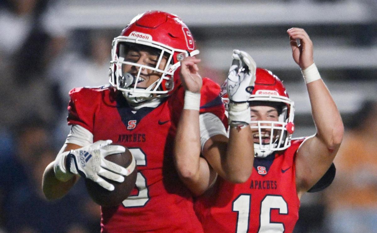 Sanger’s Marshall Pittman, right, helps celebrate Conner Bohlken’s touchdown against Dinuba in the second half Friday, Aug. 18, 2023 in Sanger. Final score, Sanger 41, Dinuba 7.