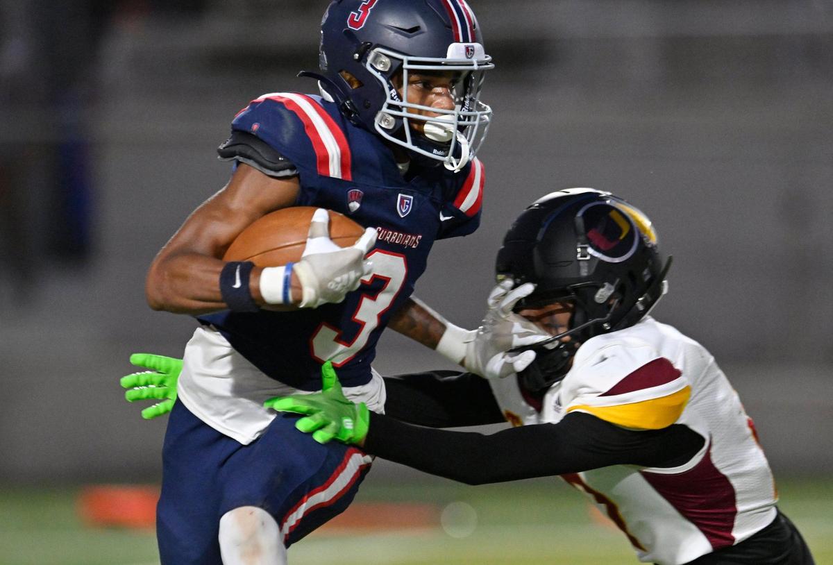 Garza’s London Alexander, left, wards off a Tulare Union defender in first half action Thursday, Sept. 7, 2023 in Fresno. Tulare led Garza 35-28 at halftime.
