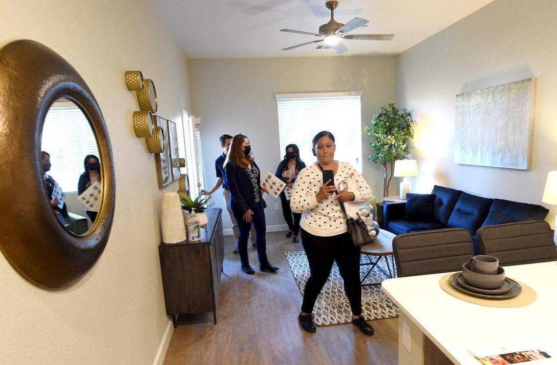 People tour Maravillosa at Campus Pointe, a 142-unit active adult senior housing complex, after ribbon-cutting ceremony was held Dec. 1, 2021.