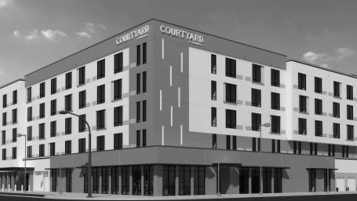 An exterior rendering of a five-story, 144-room hotel to be completed by December 2024 on an empty lot at the northeast corner of Inyo and M streets next to the Fresno Convention Center in downtown Fresno, California.