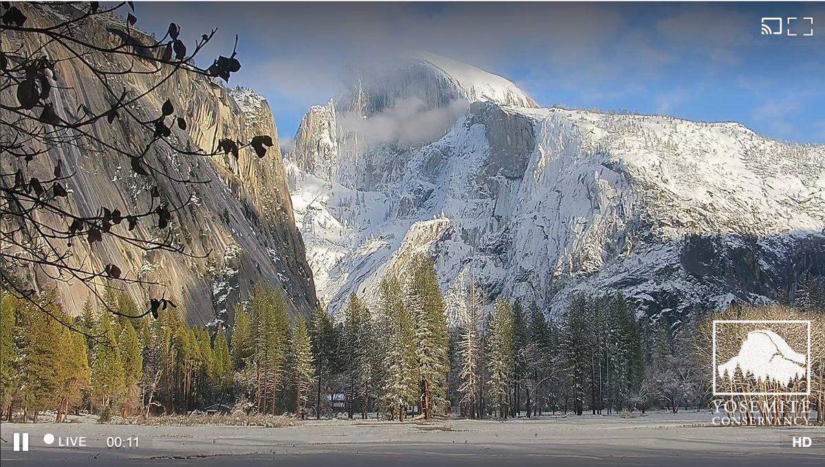 Half Dome is seen from Yosemite Valley just after 3:30 p.m. Tuesday, Jan. 17, 2023 in a screen grab from a Yosemite National Park webcam. Drivers heading to the park are urged to use caution as a storm front moves into the area Wednesday afternoon.