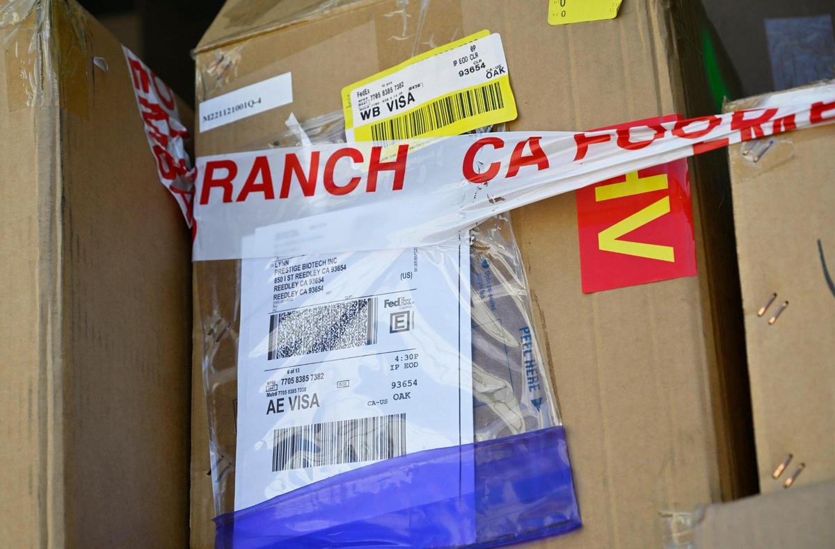 California Food and Drug Branch embargo tape is wrapped around cardboard boxes labeled for Prestige Biotech as cleanup continues at the closed warehouse location which had been illegally operated by Chinese company Prestige Biotech, seen Tuesday, August 1, 2023 in Reedley.