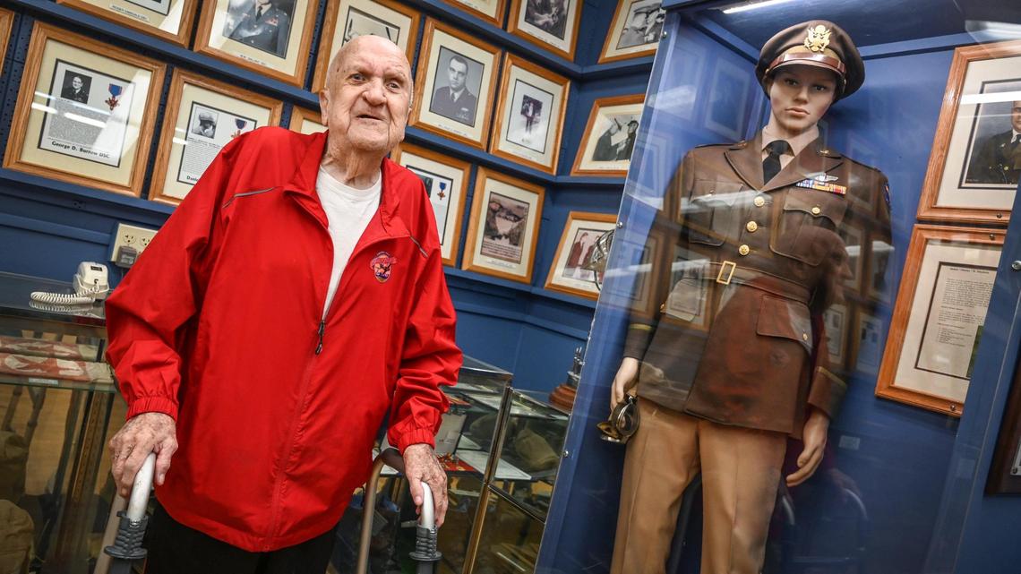 Bob Cole, 100, stands near the uniform worn by then-Lt. Col. Jimmy H. Doolittle, on the 80th anniversary of the sinking of the aircraft carrier USS Hornet (CV-8) that Cole served on, while visiting the Veterans Memorial Museum in Fresno on Wednesday, Oct. 26, 2022. Cole was photographed with Doolittle before his famous raid on Tokyo.