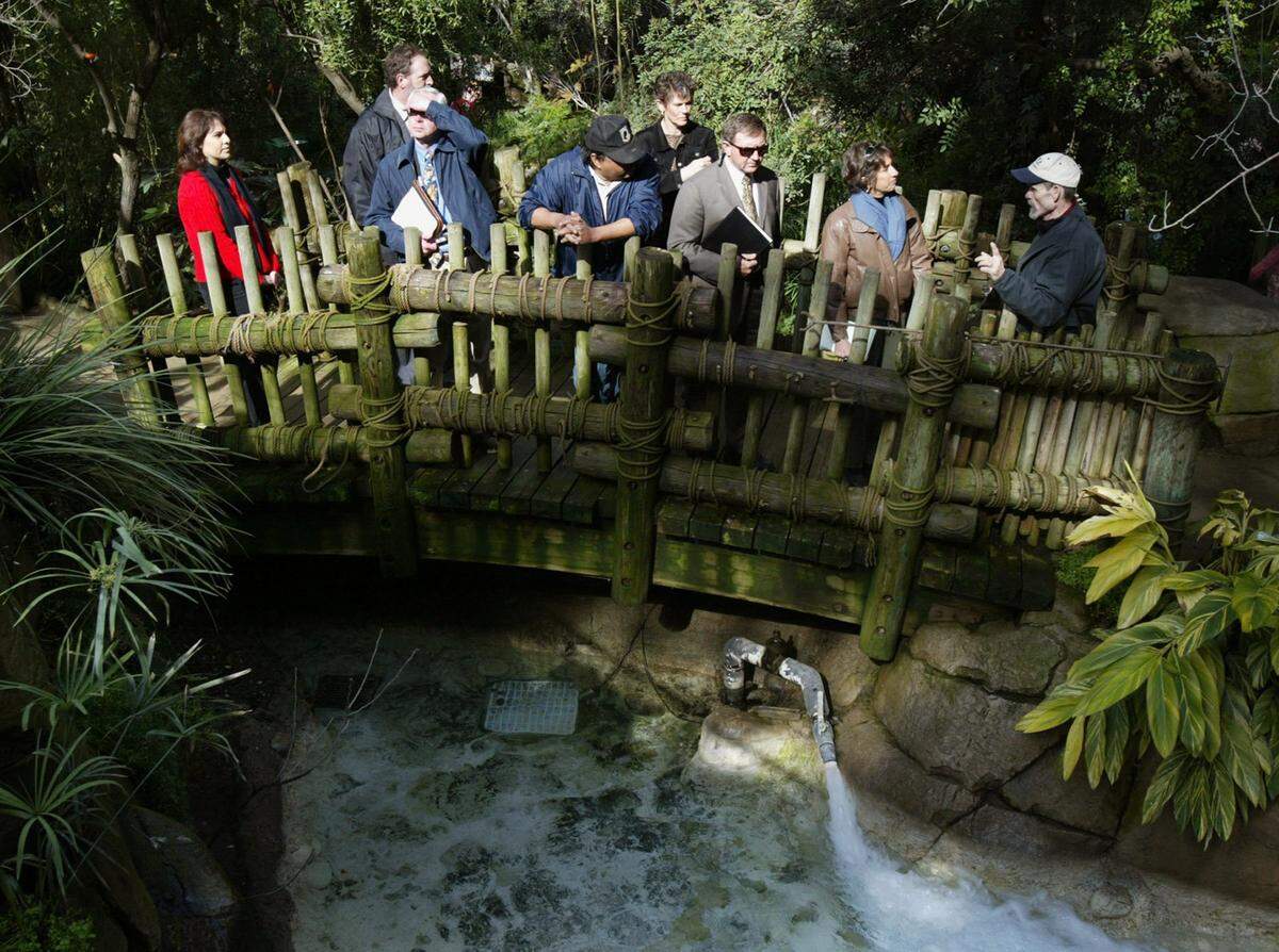 Chaffee Zoological Gardens and American Zoological and Aquarium Association representatives cross a bridge in the Rain Forest exhibit during a tour Monday, Feb. 6, 2006, in Fresno, CA.