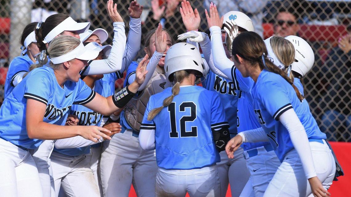 Clovis North pitcher Ryan Maddox, center, is cheered at home after a home run against Clovis High in the championship game of the Clovis Easter Classic softball tournament Monday, April 11, 2022 in Clovis. Clovis North won 7-0.