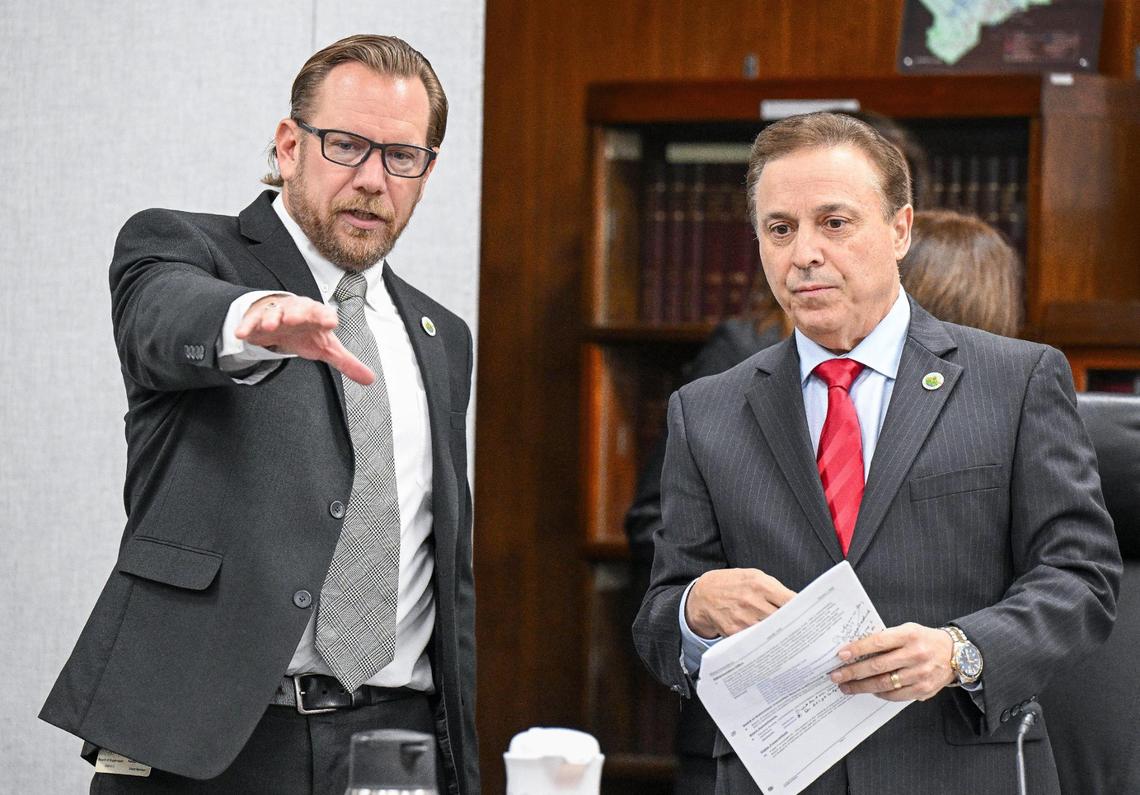 District 5 Supervisor Nathan Magsig, left, talks with District 2 Supervisor Garry Bredefeld before the start of the Fresno County Board of Supervisors meeting on Tuesday, Jan. 7, 2025.