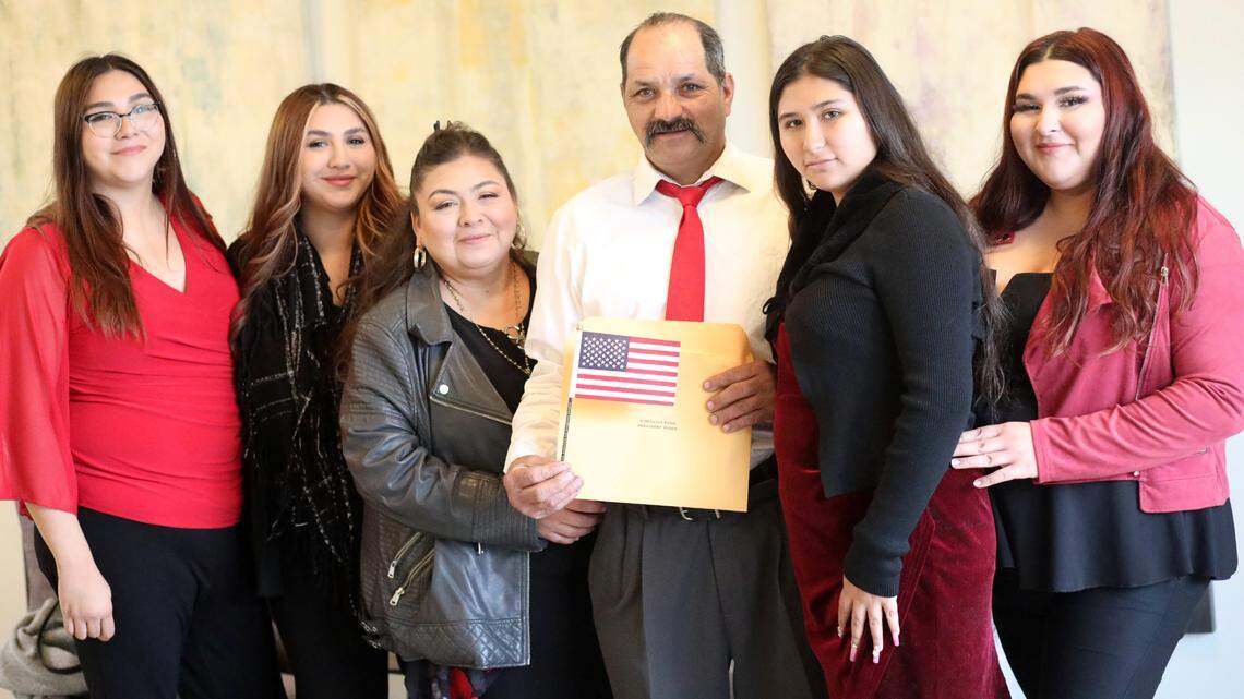 Gonzalo Barriga (center) with his family after being sworn in as U.S. citizen Wednesday (Dec. 20) afternoon at the U.S. Citizenship and Immigration Services Fresno field office.