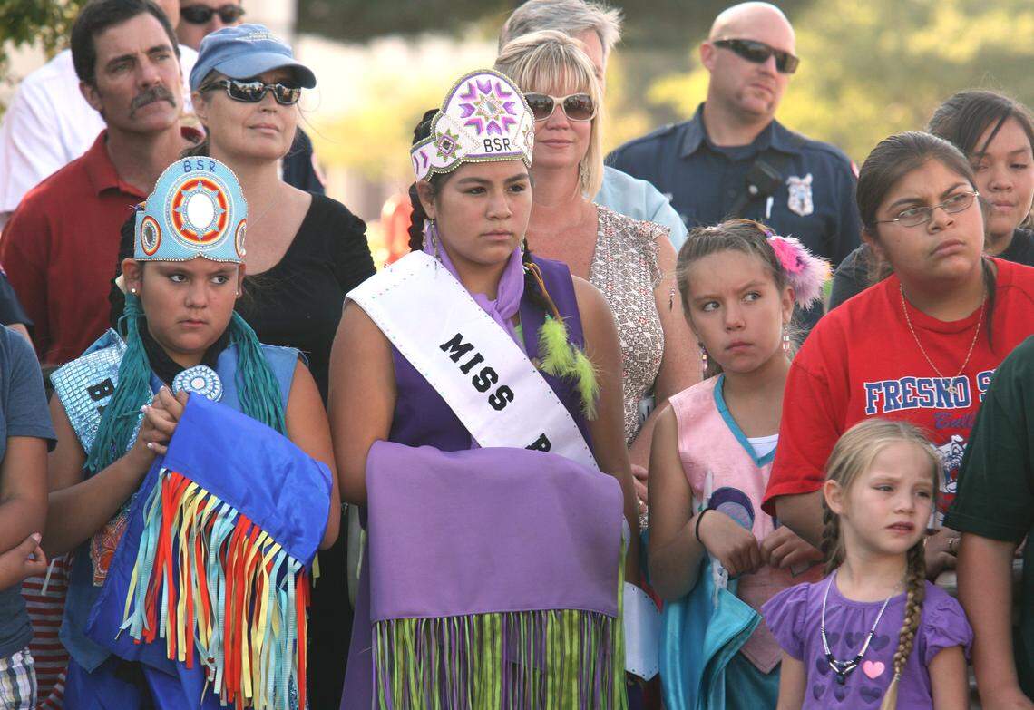 School children from Big Sandy Rancheria in Auberry, Fresno County watch the unveiling ceremonies for a statue named “The Acorn Gatherer” being installed in Clovis in 2009.