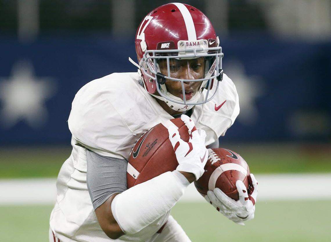 Kenyan Drake runs a drill for Alabama during a practice ahead of the NCAA Cotton Bowl college football game against Michigan State, Sunday, Dec. 27, 2015, in Arlington, Texas.