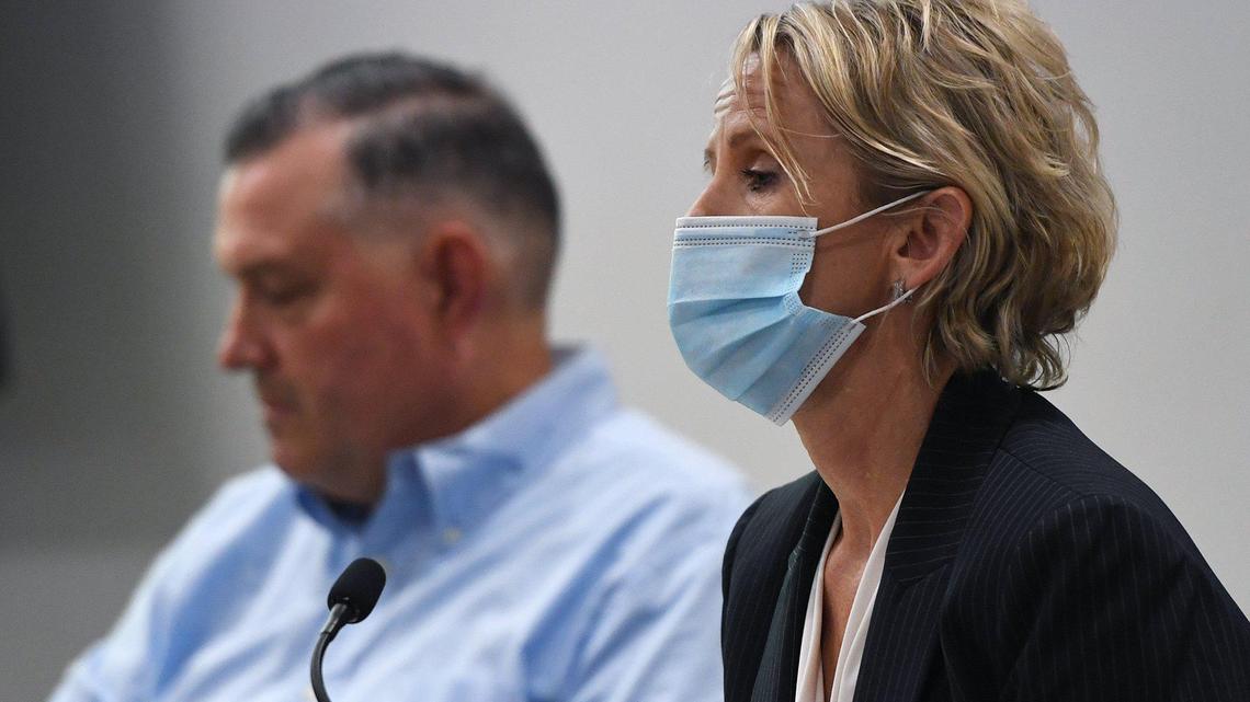 Clovis Unified School Board president Steven Fogg, left, and superintendent Eimear O’Farrell listen to parents during a meeting in August.