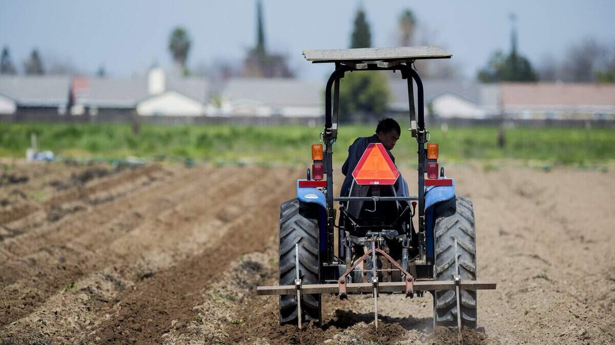A man tills the soil on a farm on Ashby Road in Merced, Calif., on Friday, March 3, 2017.