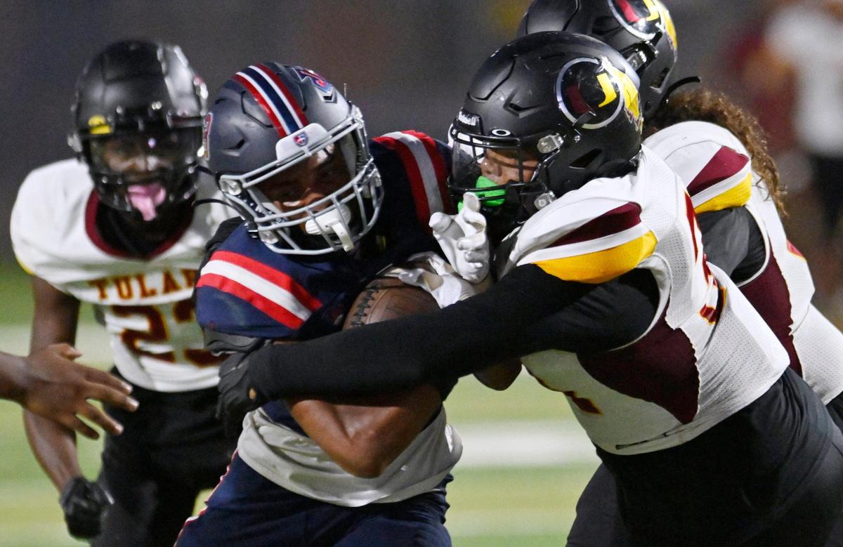Garza’s London Alexander, left, is tackled by Tulare Union’s Sevyn Strong, right, in frst half action Thursday, Sept. 7, 2023 in Fresno. Tulare led Garza 35-28 at halftime.