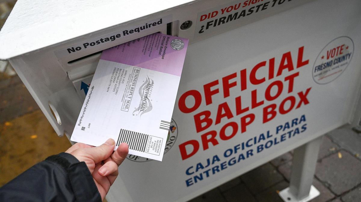 An election ballot is dropped off at a downtown Fresno voting drop box prior to Tuesday’s general election, on Monday, Nov. 7, 2022.