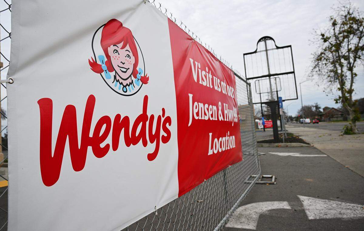 The signs for Wendy's and adjacent KFC on C Street just south of Fresno Street are empty, both reestaurants closed, seen Tuesday, Feb. 10, 2026 in downtn Fresno.