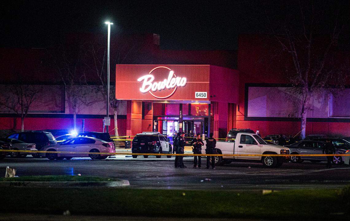 Police shut down the parking lot of the Bowlero bowling alley in northeast Fresno after a man was shot and killed near the entryway on Friday, Feb. 11, 2022.