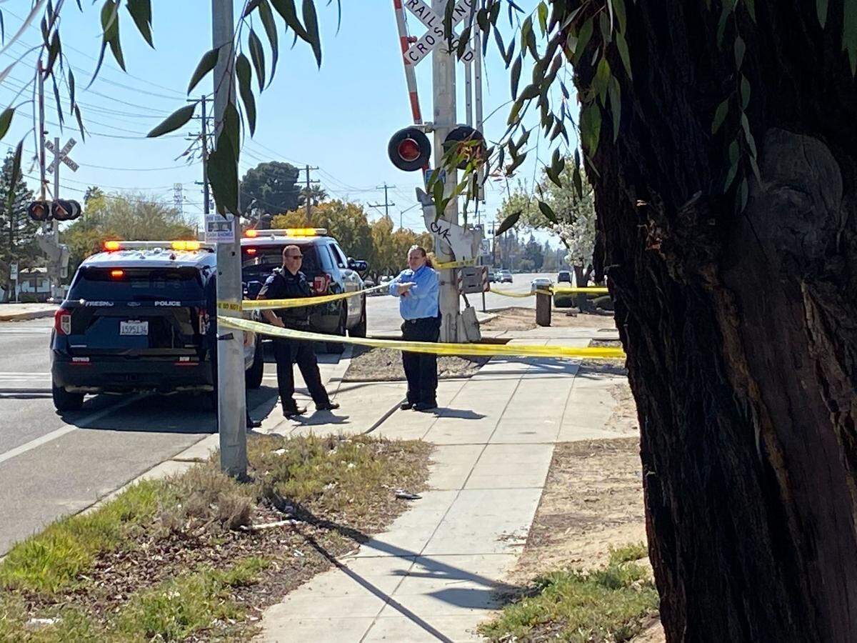 Fresno police block off railroad tracks after a person was hit and killed by an Amtrak train Friday, March 11, 2022.