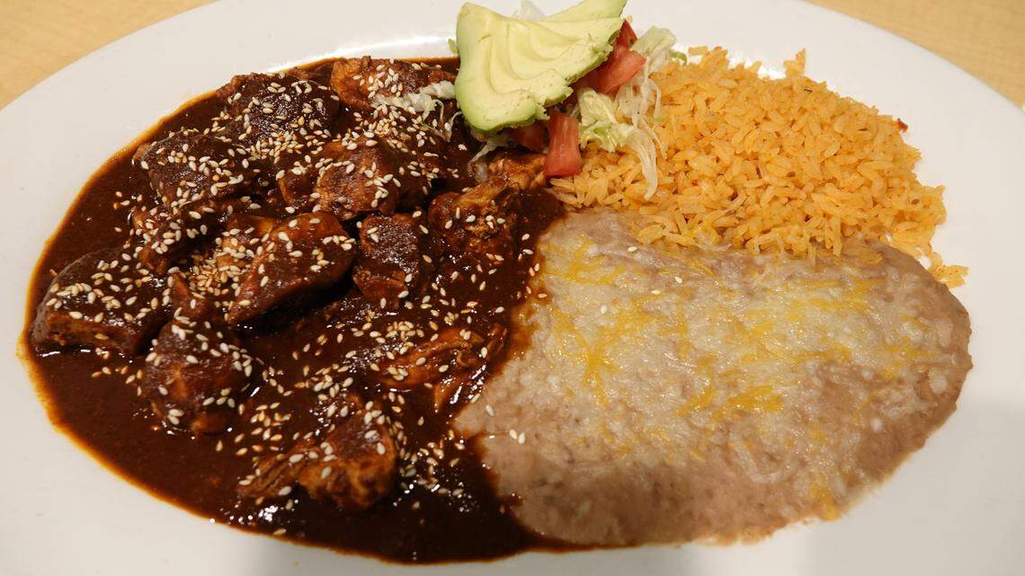 Chicken with mole sauce is a popular entree at Los Amigos Mexican Restaurant, 5088 North Blackstone Ave. in Fresno. The restaurant is opening a second location at Fresno Yosemite International Airport.