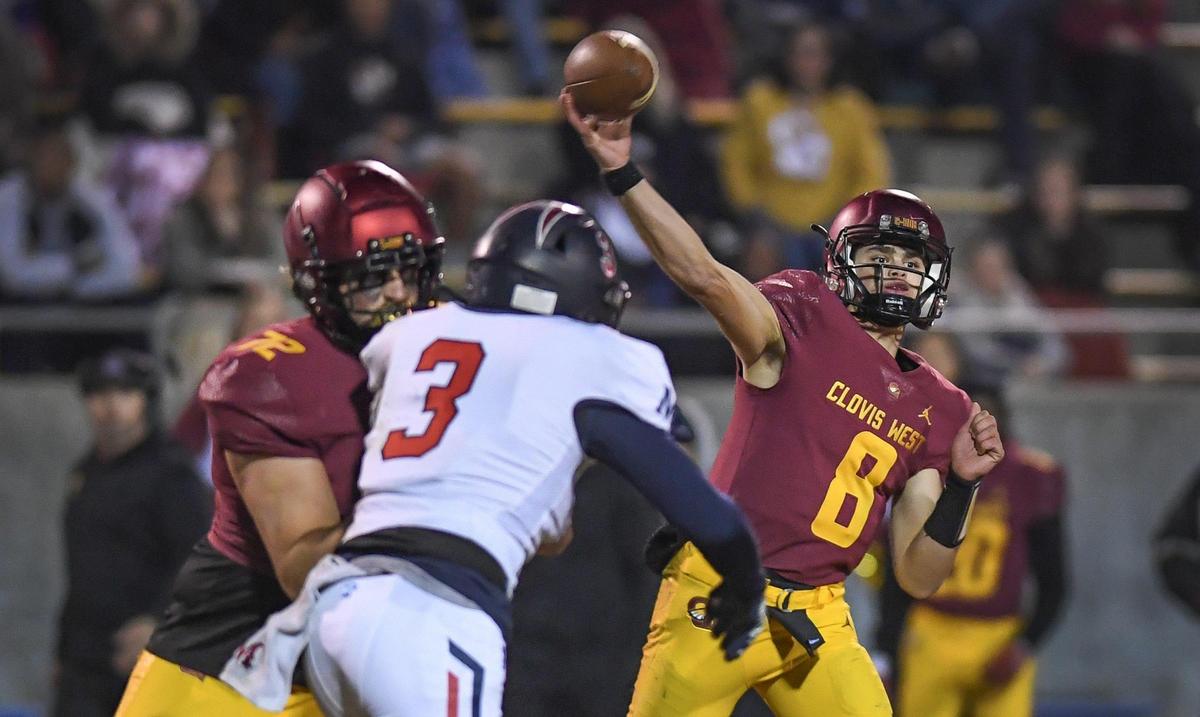 Clovis West quarterback Ryan Markarian, right, throws down field against Memorial during their Central Section semifinal playoff game at Lamonica Stadium in Clovis on Friday, Nov. 18, 2022.