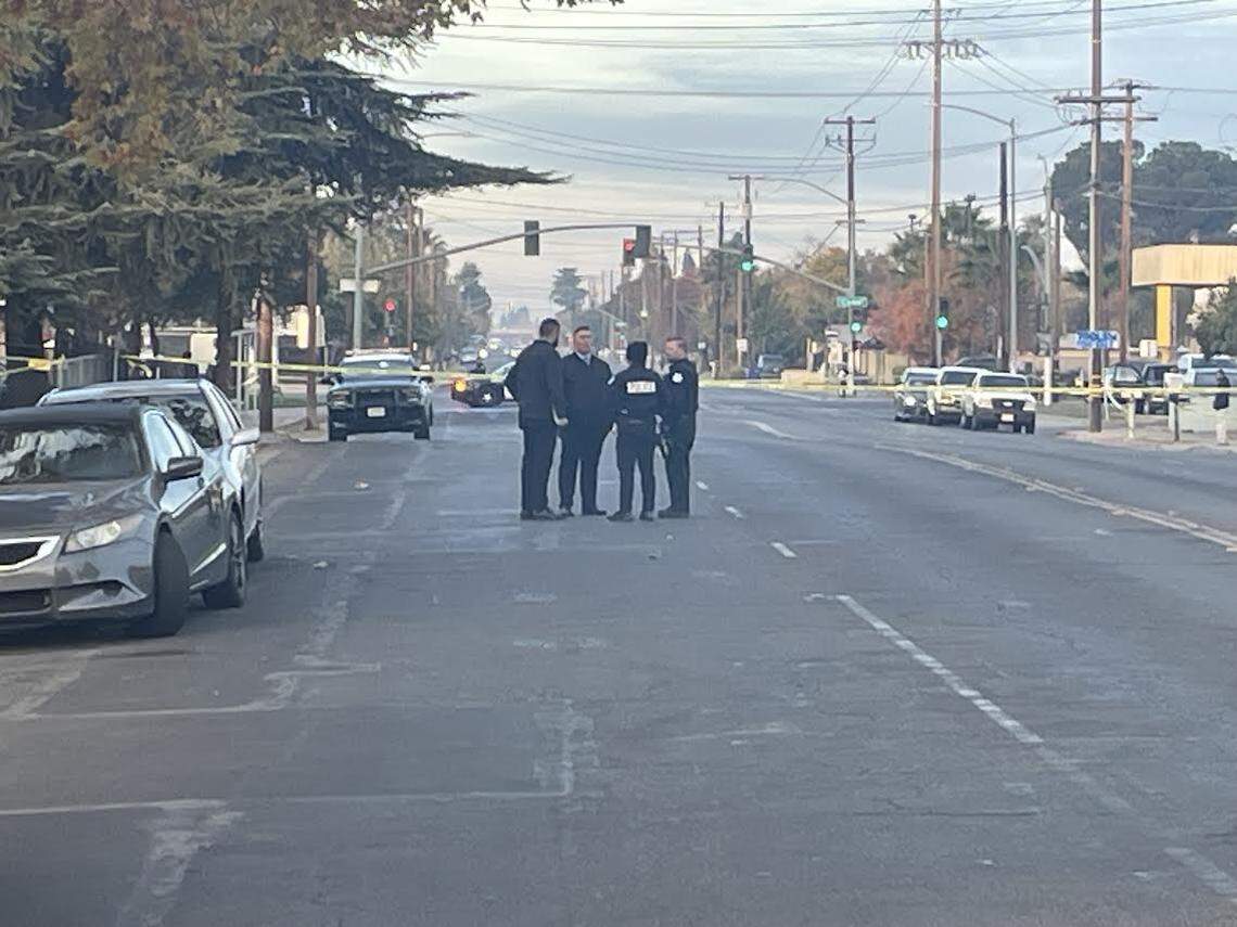 Fresno police homicide detectives arrive at the scene of a shooting where two men were slain early on Saturday, Dec. 2, 2023.