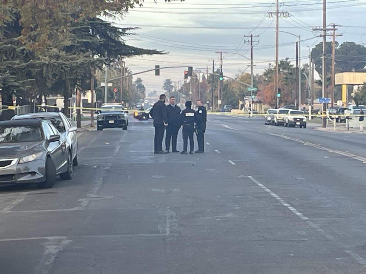 Fresno police homicide detectives arrive at the scene of a shooting in which two men were slain early on Saturday, Dec. 2, 2023.