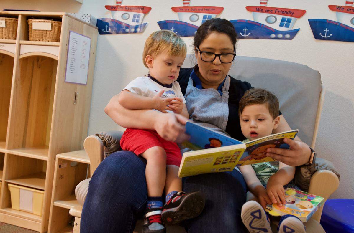 A teacher reads to children in the toddler room at the Lighthouse for Children, a unique childcare program in downtown Fresno that’s run through a partnership with Fresno County and First Five Fresno.