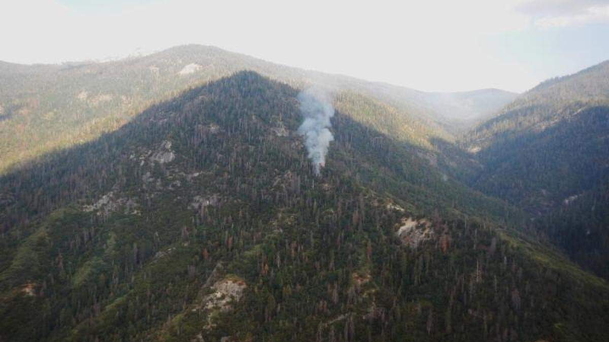 The Horse Creek fire in Sequoia National Park sends up a plume of smoke.