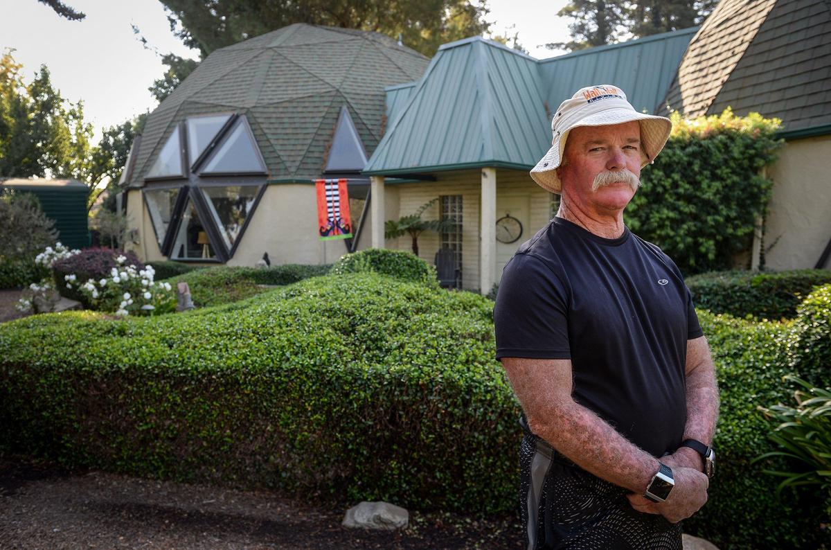 Bryant “Bear” Johnston stands outside his home in the Rolling Hills area of Madera near Highway 41 and Avenue 12 on Monday, Oct. 14, 2019. Hundreds of new homes in the Riverstone development are being built just beyond Johnston’s neighborhood, which he once thought of as quiet and country-like.