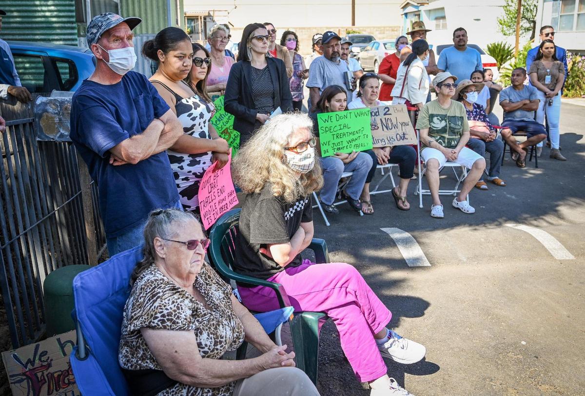 Residents of La Hacienda Mobile Home Park (former name Trails End) listen to Fresno Mayor Jerry Dyer and Fresno City Councilmember Garry Bredefeld during a meeting at the park on Friday, March 25, 2022.
