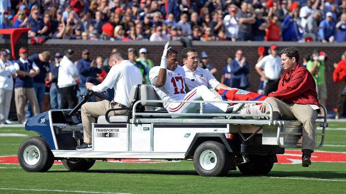 Then-Alabama running back Kenyan Drake (17) waves while being taken off the field after an injury during the first half of an NCAA college football game against Mississippi in Oxford, Miss., Saturday, Oct. 4, 2014.