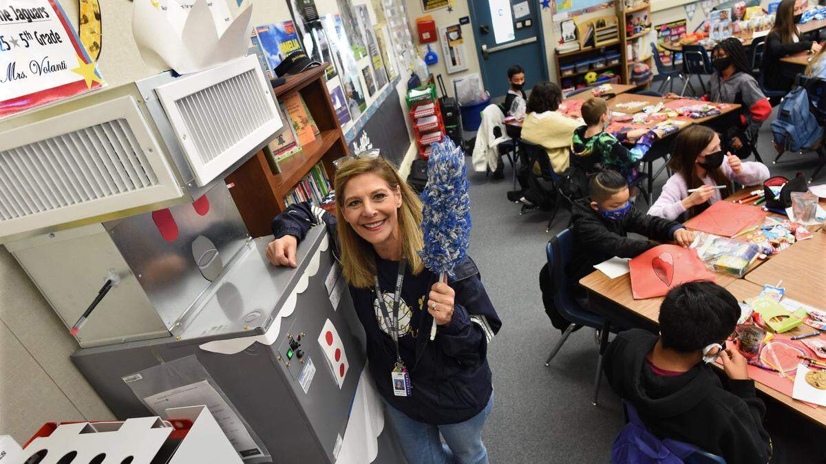 Clovis Elementary School fifth grade teacher Tina Volanti shows the HEPA-grade Carrier air filtration unit nicknamed Rosie, the robot maid from the 1960s cartoon series The Jetsons, her students decorated.