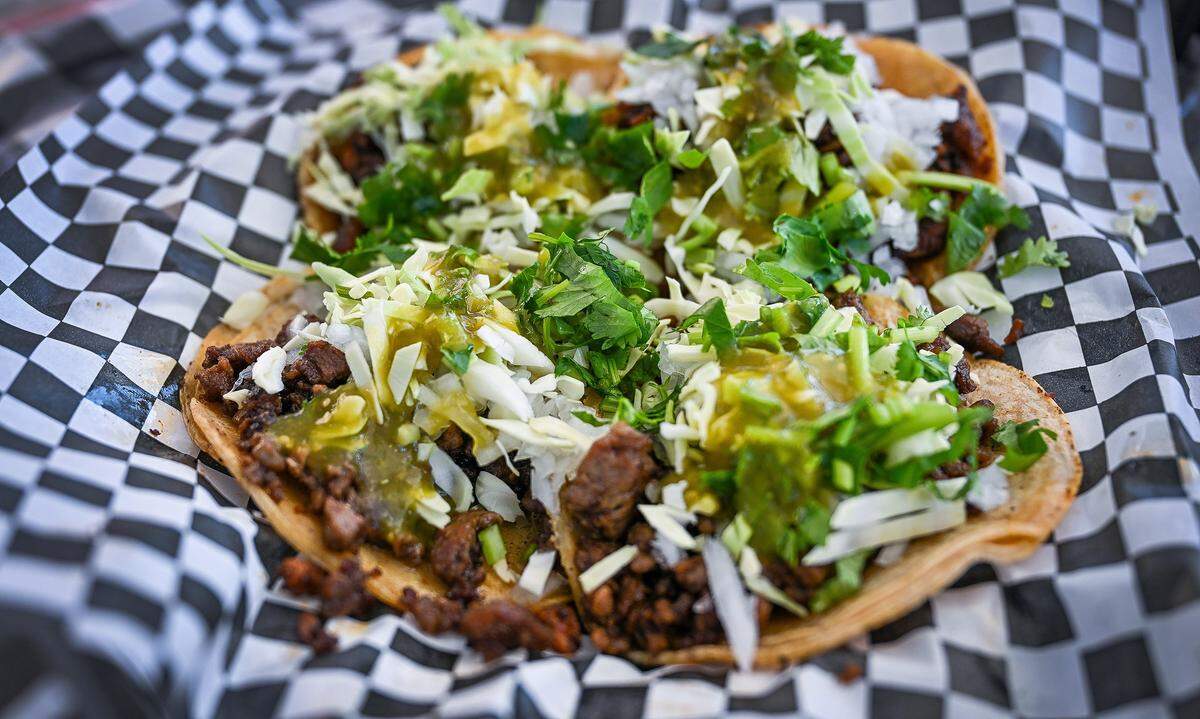 Tacos are served up at the Tacos La Vaporera taco truck on Tuesday, Nov. 4, 2025. 