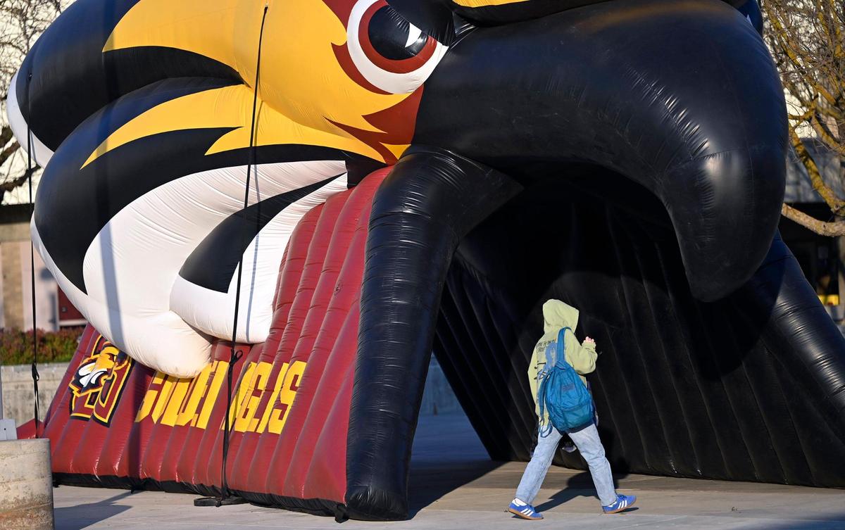 A students walks past the Clovis West Golden Eagle inflatable tunnel Thursday afternoon, Jan. 30, 2025 in Fresno.