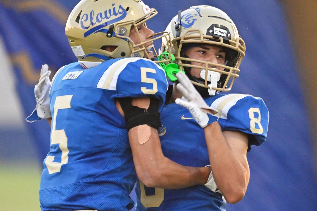 Clovis High’s Jacob Saldate, left, celebrates Tyler Marquez’s touchdown against Garces in the first game of the season Thursday, Aug. 17, 2023 in Clovis.
