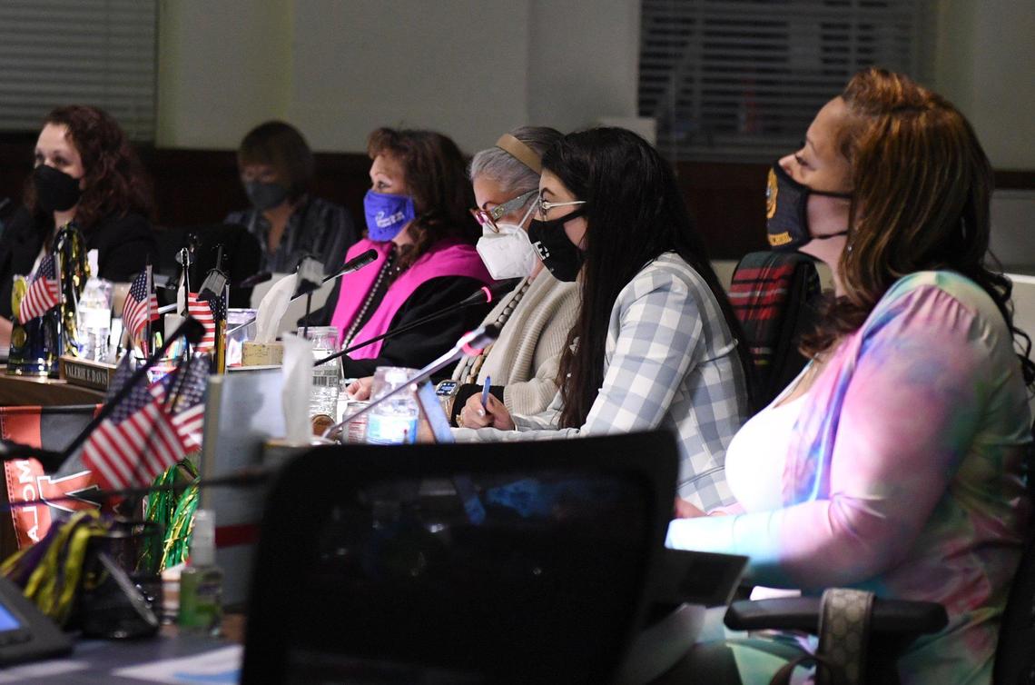 School board members left to right, Claudia Cazares, Valerie Davis, Veva Islas, Elizabeth Jonasson Rojas and Keshia Thomas listen during the Fresno Unified School Board meeting Wednesday night, Feb. 16, 2022 in Fresno.