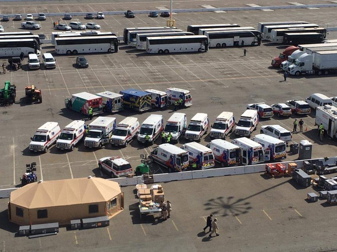 Ambulances and buses near the Grand Princess, as seen from the balcony of Tom and Paula Yost’s cruise ship room. The ship docked in the Port of Oakland on March 9, 2020.
