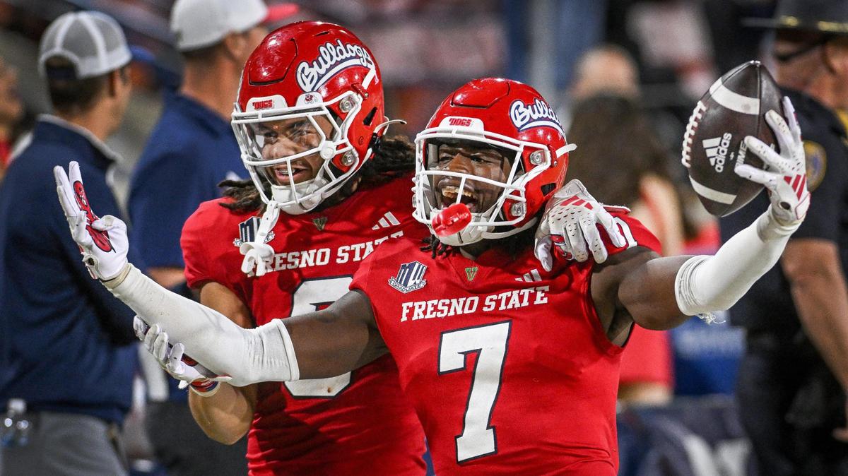 Fresno State’s Morice Norris Jr., right, celebrates with Levelle Bailey after Norris intercepted the ball against Nevada during their game at Valley Children’s Stadium on Saturday, Sept. 30, 2023.